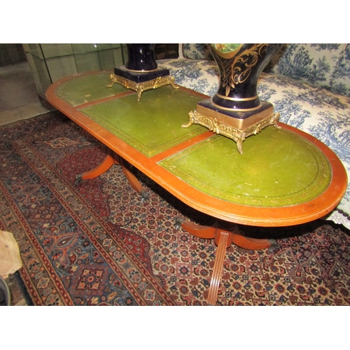 1355 - Yew Wood Oval From Coffee Table Green Leather Inset Above Twin Tripod Bases Approximately 50 Inches ... 