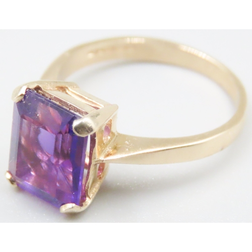 140 - Emerald Cut Amethyst Four Claw Set Single Stone Ring Mounted in 9 Carat Yellow Gold Ring Size M and ... 