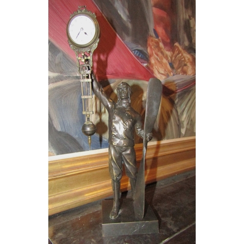 1411 - Aviator Motif Bronze Clock with Hanging Pendulum Approximately 12 Inches High