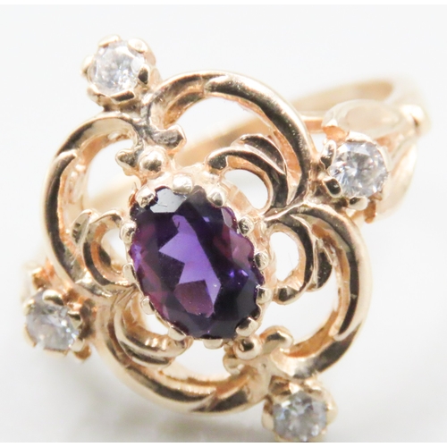 147 - Amethyst and Four Stone Diamond Set Ladies Ring Attractively Detailed Mounted in 9 Carat Yellow Gold... 