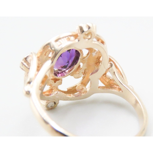 147 - Amethyst and Four Stone Diamond Set Ladies Ring Attractively Detailed Mounted in 9 Carat Yellow Gold... 