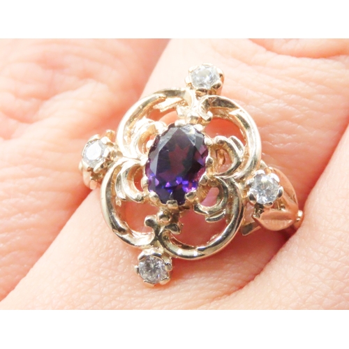 147 - Amethyst and Four Stone Diamond Set Ladies Ring Attractively Detailed Mounted in 9 Carat Yellow Gold... 