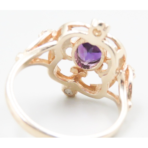 147 - Amethyst and Four Stone Diamond Set Ladies Ring Attractively Detailed Mounted in 9 Carat Yellow Gold... 