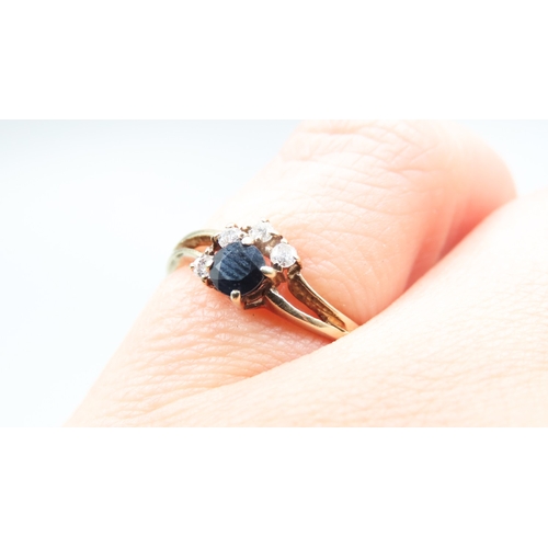 158 - Sapphire and Diamond Set Ladies Cluster Ring Mounted in 9 Carat Yellow Gold Ring Size L