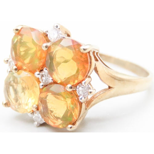 159 - Mexican Opal Four Stone Set Ring with Further Diamond Inset Mounted in 9 Carat Yellow Gold Ring Size... 