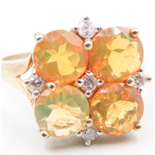 159 - Mexican Opal Four Stone Set Ring with Further Diamond Inset Mounted in 9 Carat Yellow Gold Ring Size... 