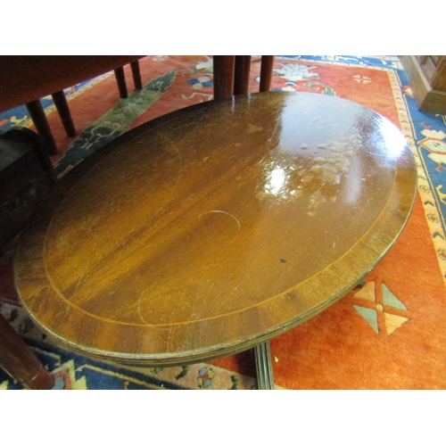 1641 - Mahogany Crossbanded Oval Form Coffee Table Approximately 36 Inches Wide x 20 Inches High Tripod Sup... 