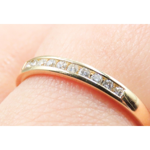 169 - Diamond Ten Stone Channel Set Band Ring Mounted in 18 Carat Yellow Gold Ring Size R