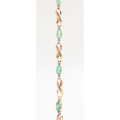 Emerald and Diamond Set Ladies Crossover Link Bracelet Mounted in 14 Carat Yellow Gold 18cm Long