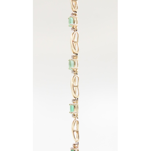 185 - Emerald and Diamond Set Ladies Crossover Link Bracelet Mounted in 14 Carat Yellow Gold 18cm Long