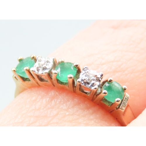 21 - Emerald and Diamond Set Ladies Five Stone Ring Mounted in 14 Carat Yellow Gold Ring Size M