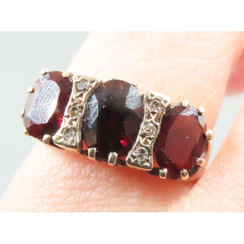 222 - Red Garnet Set Ring Mounted in 9 Carat Yellow Gold with Further Diamond Insets Ring Size M