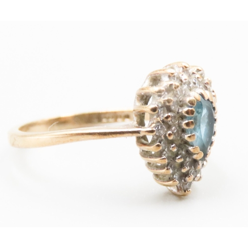 227 - Pear Cut Blue Topa\ Set Ring with Diamond Set Halo Surround Mounted in 9 Carat Yellow Gold Ring Size... 