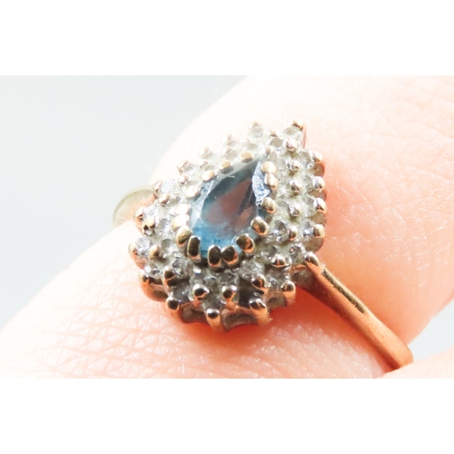 227 - Pear Cut Blue Topa\ Set Ring with Diamond Set Halo Surround Mounted in 9 Carat Yellow Gold Ring Size... 