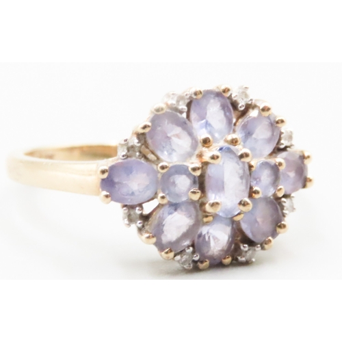 232 - Amethyst and Diamond Set Ladies Floral Form Cluster Ring Mounted in 9 Carat Yellow Gold Ring Size R