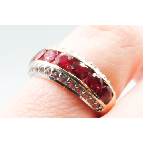 233 - Red Garnet Seven Stone Set Ring with Further Gemstones Set to Sides Mounted in 9 Carat Yellow Gold R... 