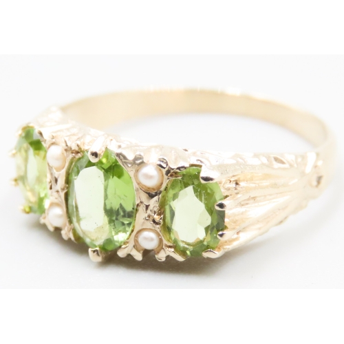 245 - Three Stone Peridot and Seed Pearl Set Ring Attractively Detailed Mounted in 9 Carat Yellow Gold Rin... 