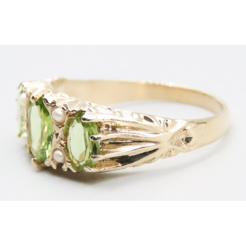 245 - Three Stone Peridot and Seed Pearl Set Ring Attractively Detailed Mounted in 9 Carat Yellow Gold Rin... 