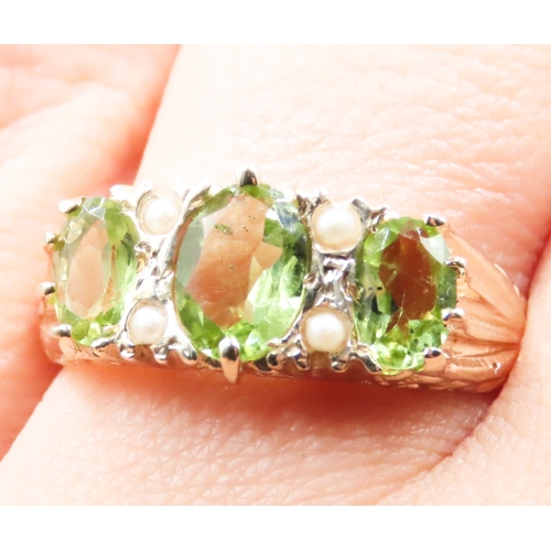 245 - Three Stone Peridot and Seed Pearl Set Ring Attractively Detailed Mounted in 9 Carat Yellow Gold Rin... 