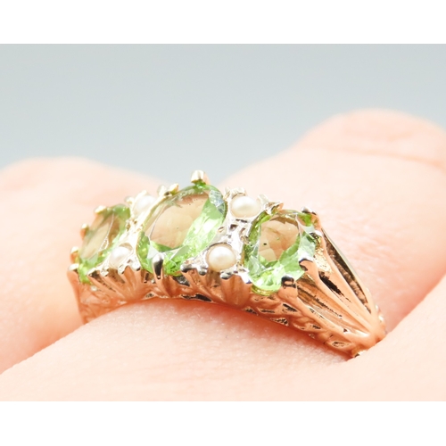 245 - Three Stone Peridot and Seed Pearl Set Ring Attractively Detailed Mounted in 9 Carat Yellow Gold Rin... 