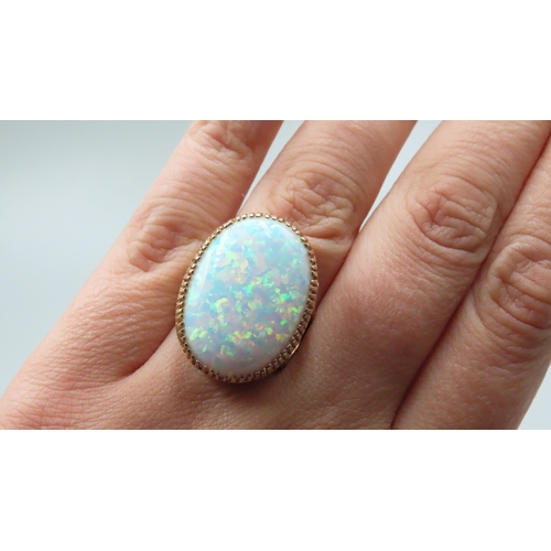 254 - Finely Detailed Basket Set Opal Single Stone Ring Mounted in 9 Carat Yellow Gold Ring Size P