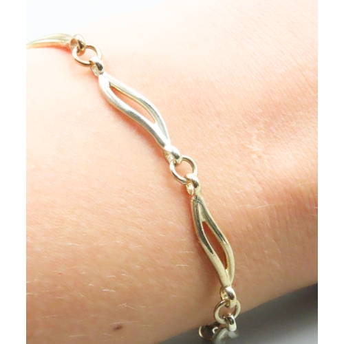 259 - 9 Carat Yellow and White Gold Wave Link Bracelet 20cm Long