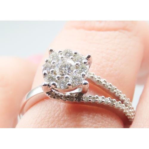 283 - KALLATI Diamond Set Ladies Cluster Ring Finely Detailed with Further Diamonds Set to Band Mounted in... 