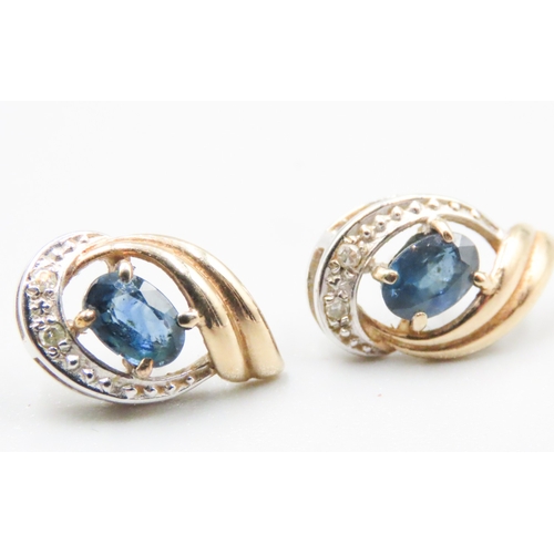 30 - Pair of Sapphire and Diamond Set Ladies Swirl Motif Earrings Mounted in 9 Carat Yellow and White Gol... 