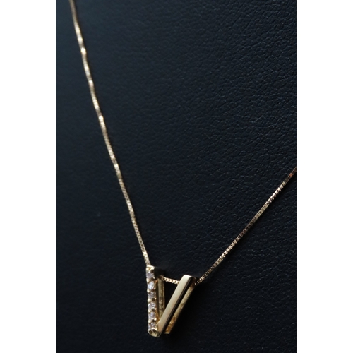 303 - 18 Carat Yellow Gold Diamond Set Pendant 1cm High Set on 18 Carat Yellow Gold Chain 44cm Long