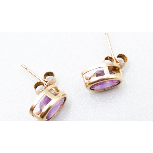 307 - Pair of Amethyst Bezel Set Earrings Mounted in 9 Carat Yellow Gold 1cm High