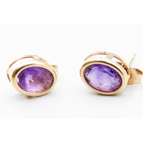 307 - Pair of Amethyst Bezel Set Earrings Mounted in 9 Carat Yellow Gold 1cm High