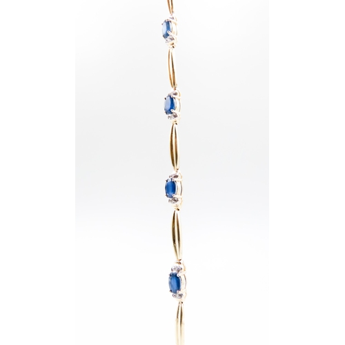 332 - Sapphire Six Stone Set Bracelet with Further Diamond Inset Mounted in 14 Carat Yellow Gold 17.5cm Lo... 