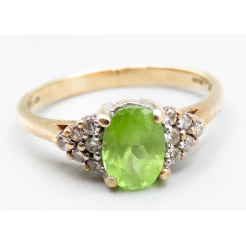 334 - Peridot and Diamond Cluster Set Ring Mounted in 14 Carat Yellow Gold Ring Size L