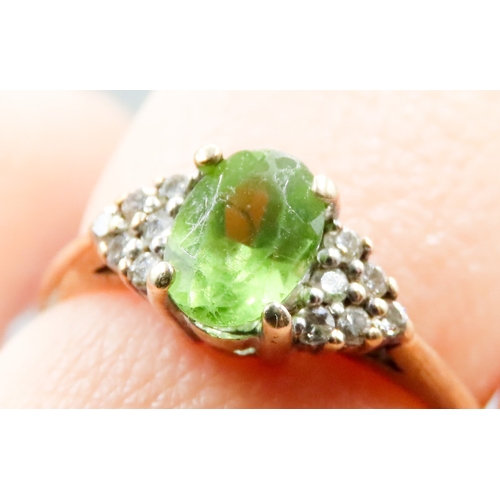 334 - Peridot and Diamond Cluster Set Ring Mounted in 14 Carat Yellow Gold Ring Size L