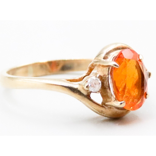 336 - Fire Opal Set Ring with Further Diamonds Set to Shoulders Mounted in 9 Carat Yellow Gold Ring Size M