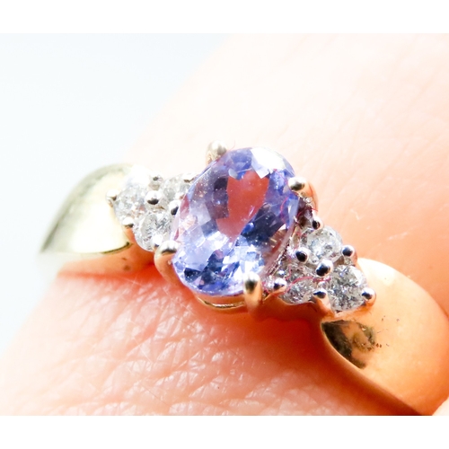 337 - Tanzanite and Diamond Cluster Set Ring Mounted in 14 Carat Yellow Gold Ring Size L