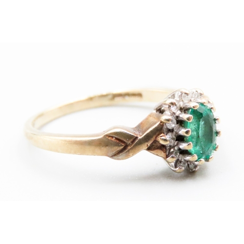 338 - Synthetic Emerald and Diamond Set Ladies Cluster Ring Mounted in 9 Carat Yellow Gold Ring Size O