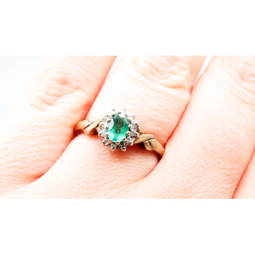 338 - Synthetic Emerald and Diamond Set Ladies Cluster Ring Mounted in 9 Carat Yellow Gold Ring Size O