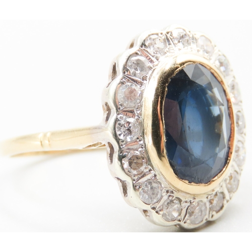 350 - 6 Carat Bezel Sapphire Centre Stone Ring with Sixteen Stone Diamond Set Halo Surround Mounted in 18 ... 