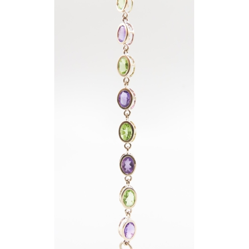 370 - Fifteen Stone Peridot and Amethyst Bezel Set Bracelet Mounted in 9 Carat Yellow Gold 19.5cm Long