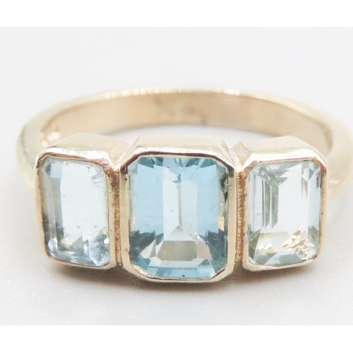 383 - Three Stone Bezel Set Sky Blue Topaz Ring Mounted in 9 Carat Yellow Gold Ring Size N