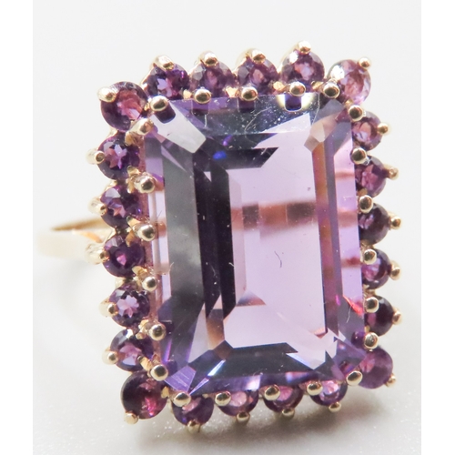 384 - Emerald Cut Amethyst Ring Set with Amethyst Halo Surround Mounted in 9 Carat Yellow Gold Ring Size O... 