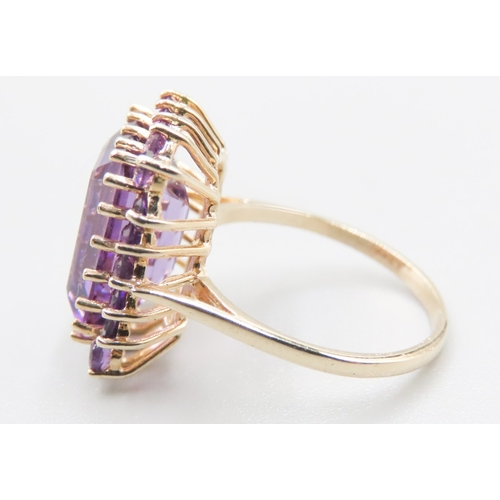 384 - Emerald Cut Amethyst Ring Set with Amethyst Halo Surround Mounted in 9 Carat Yellow Gold Ring Size O... 