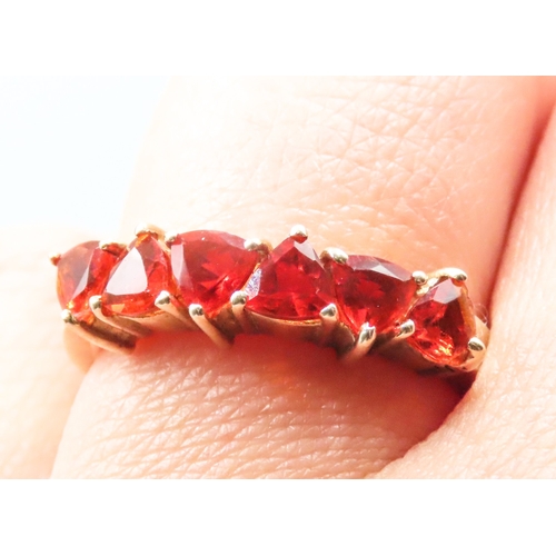 43 - Orange Garnet Six Stone Set Ring Mounted in 9 Carat Yellow Gold Ring Size P and a Half