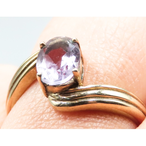 44 - Pale Amethyst Single Stone Ring Wrap Around Form Mounted in 9 Carat Yellow Gold Ring Size P