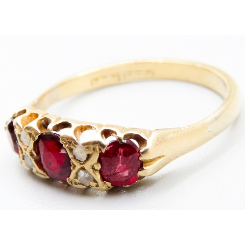 440 - Three Stone Red Garnet Ring with Further Diamond Insets Mounted in 18 Carat Yellow Gold Ring Size R