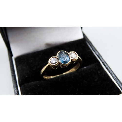 444 - Sapphire and Diamond Bezel Set Three Stone Ring Mounted in 18 Carat Yellow Gold Ring Size M