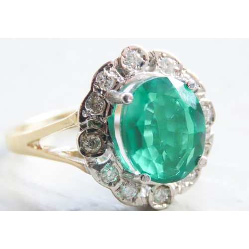 68 - Emerald Triplet Centre Stone Ring with Diamond Set Halo Surround Mounted in 9 Carat Yellow Gold Ring... 