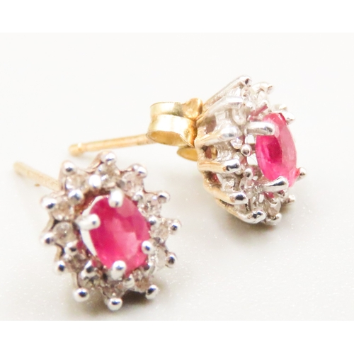 7 - Pair of Ruby and Diamond Set Ladies Cluster Earrings Mounted in 9 Carat Yellow Gold 7mm High