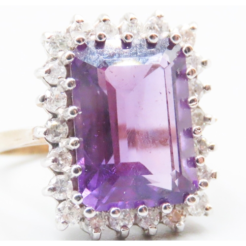 70 - Emerald Cut Amethyst Centre Stone Ring with Diamond Set Halo Surround Mounted in 9 Carat Yellow Gold... 